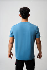 Load image into Gallery viewer, Model in Blue Performance Tee
